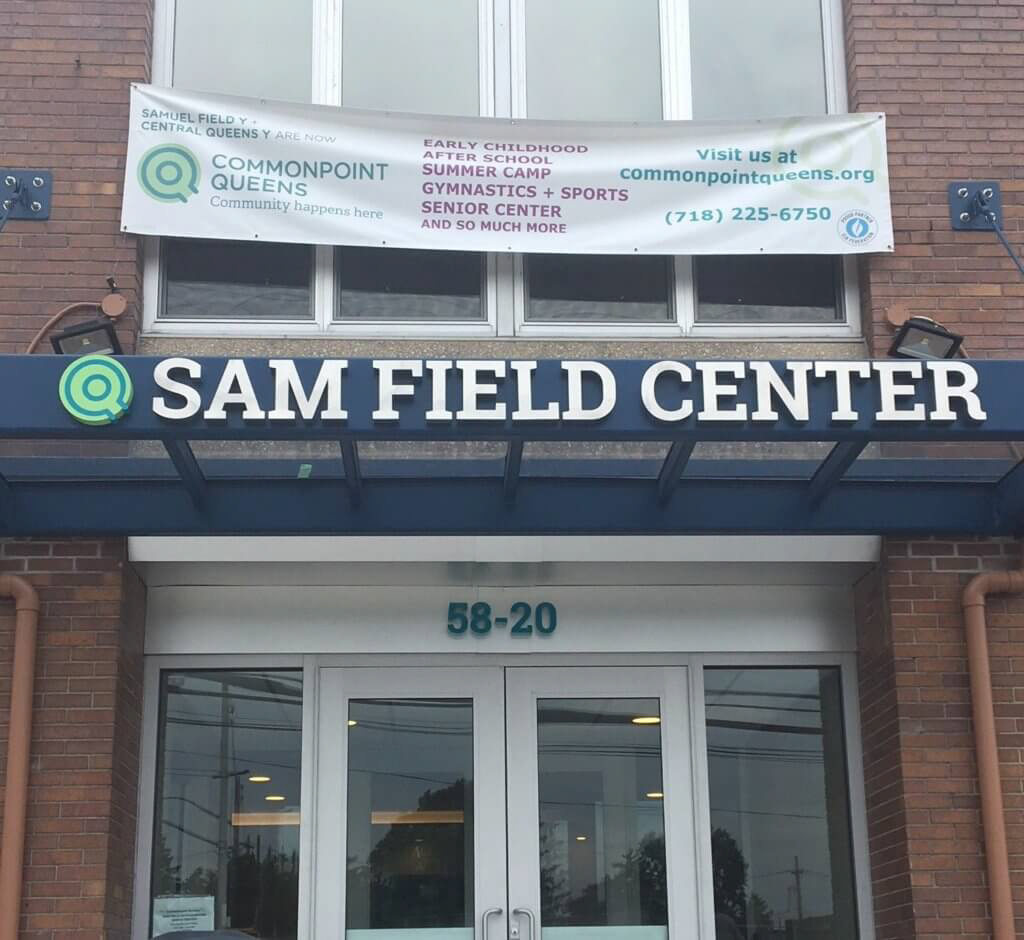 A building with a sign that says sam field center.